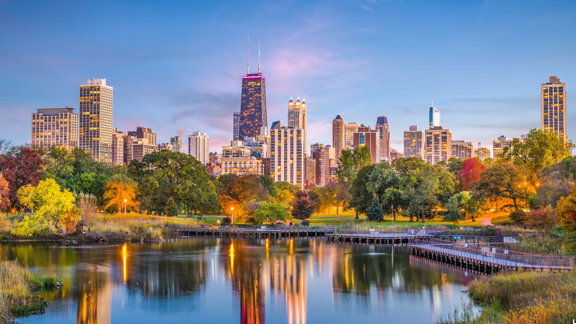 The city skyline is reflected in the water