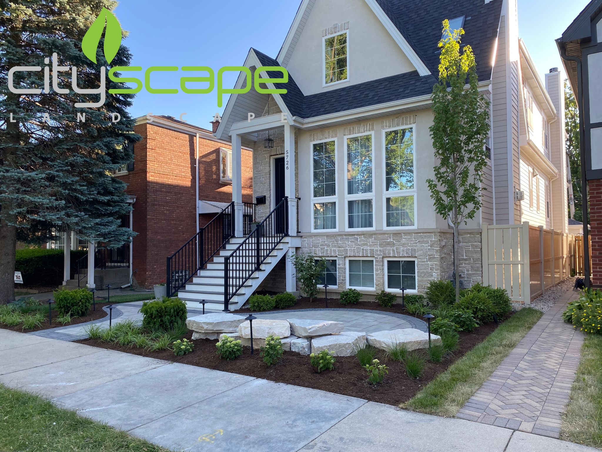 A house with landscaping in front of it