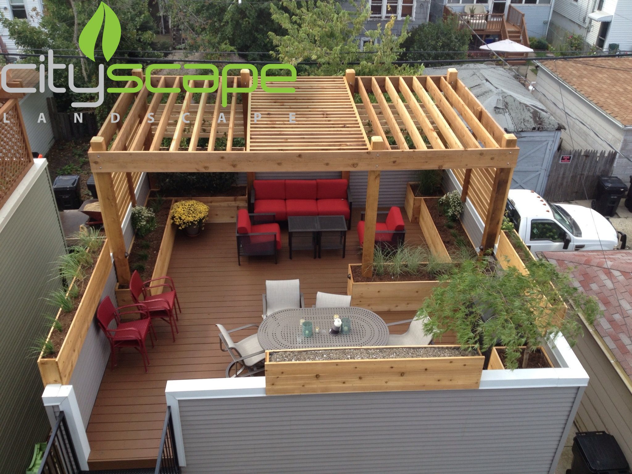 A deck with a table and chairs and a fire pit