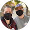 A man and a woman wearing face masks