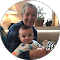 A man holding a baby in his arms